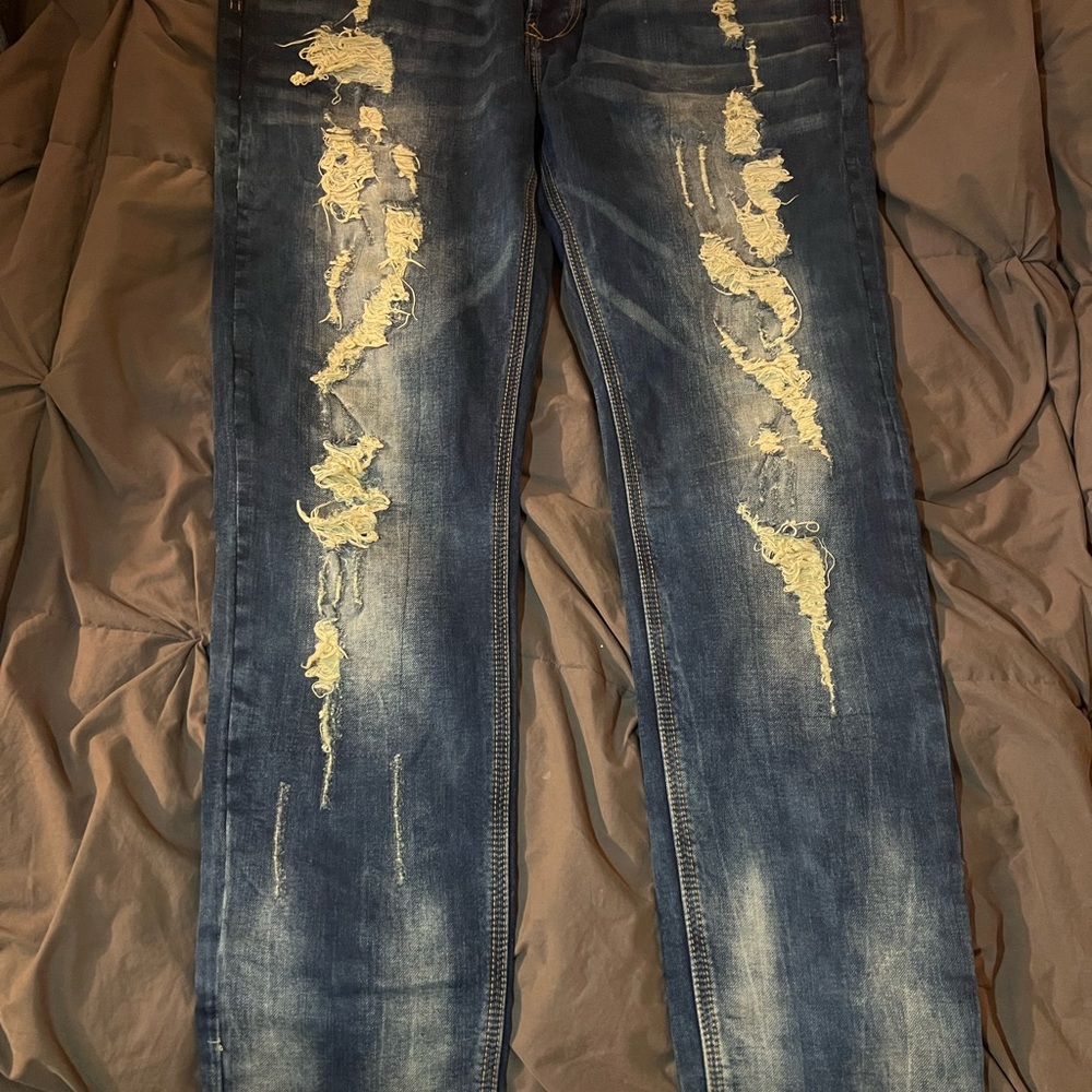 Distressed Blue Denim Jeans